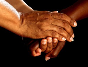 Two people clasping hands