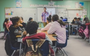 teacher and classroom of students