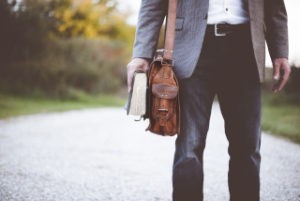 Man walking in street, shot of his briefcase