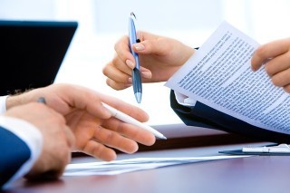 A person signing a contract