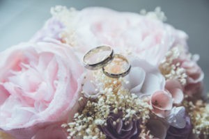 Two rings on a bouquet 