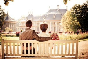 two people sitting on a bench