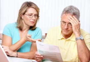 two people reviewing bills