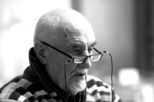 Elderly man with glasses