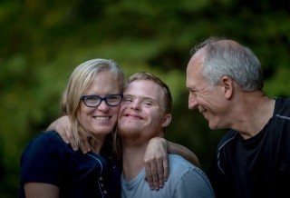 special needs child with his parents