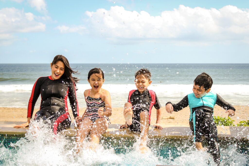 Family splashing water at a swimming pool